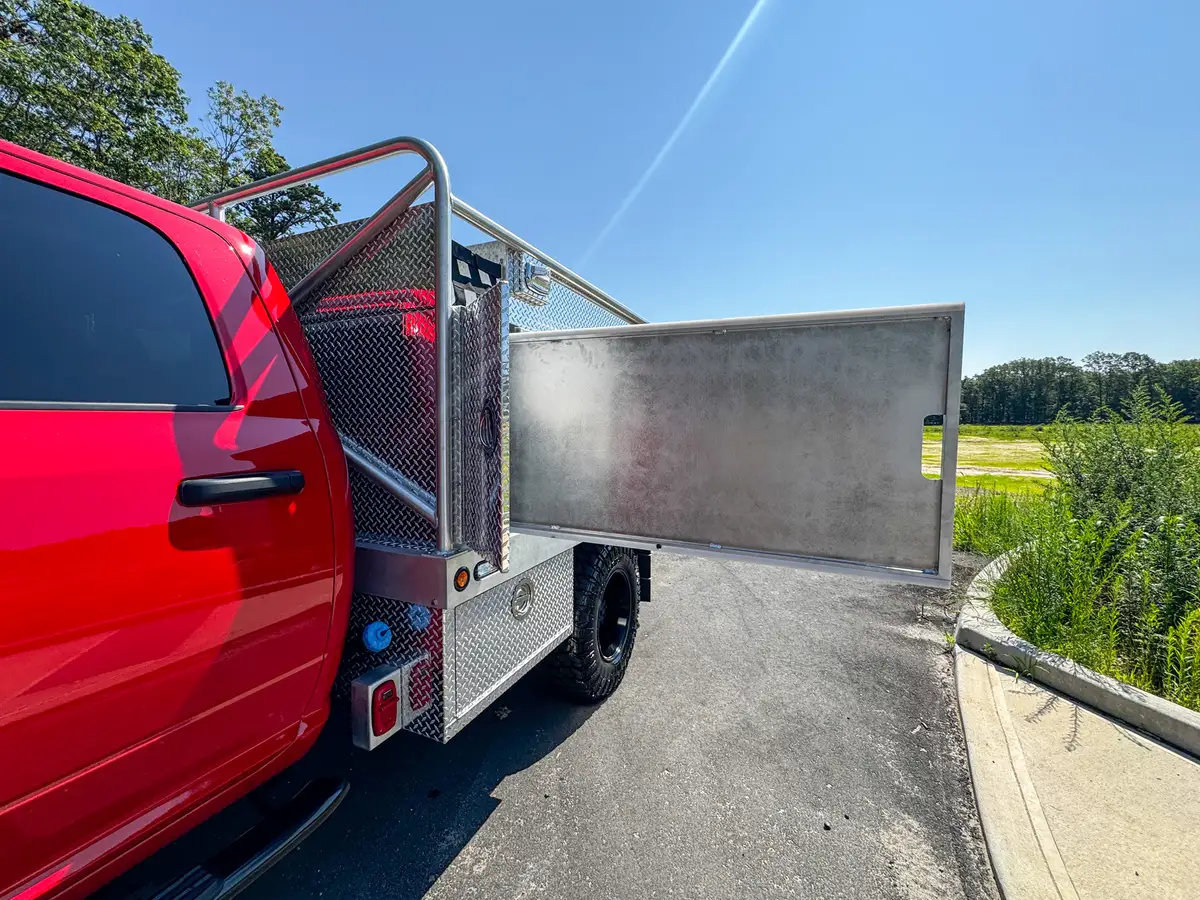 Interior view of side roll-up compartment showing shelves and empty bays.